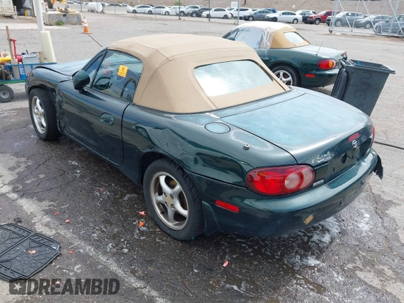 2002 Mazda MX-5 Miata Cloth z VIN JM1NB353720222073, wystawiony jako IAAI lot #42225042 z przebiegiem 94 992 mil mil oraz . Historia ofert i sprzedaży dostępna na DreamBid. Obrazek 3.