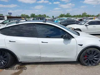 2021 Tesla Model Y Performance with VIN 5YJYGDEF9MF081798, listed as a IAAI auction lot 42033358 with 64,679 mi miles and . Bid and sale history available at DreamBid. Image 14.