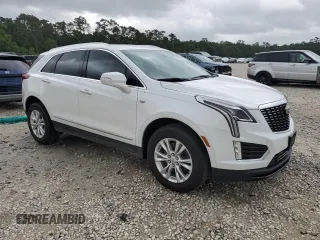 2024 Cadillac XT5 FWD Luxury with VIN 1GYKNAR4XRZ747310, listed as a Copart auction lot 55598585 with 14,371 mi miles and Salvage title. Bid and sale history available at DreamBid. Image 4.