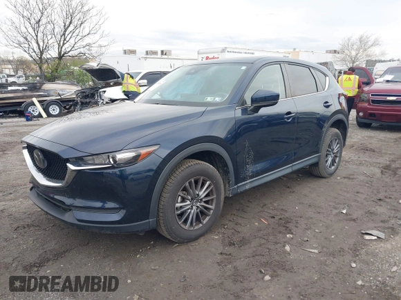 2021 Mazda CX-5 Touring with VIN JM3KFBCM1M1336457, listed as a IAAI auction lot 42034330 with 39,910 mi miles. Bid and sale history available at carsss.com. Image 2.