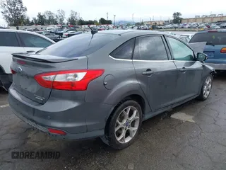 2013 Ford Focus Titanium with VIN 1FADP3J2XDL270393, listed as a IAAI auction lot 41814775 with 76,907 mi miles and . Bid and sale history available at carsss.com. Image 4.