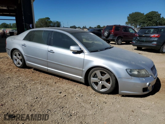 2004 Volkswagen Phaeton V8 z VIN WVWAF63D748010147, wystawiony jako Copart lot #75843654 z przebiegiem 147 157 mil mil oraz Nie do naprawy • Non repairable. Historia ofert i sprzedaży dostępna na DreamBid. Obrazek 4.