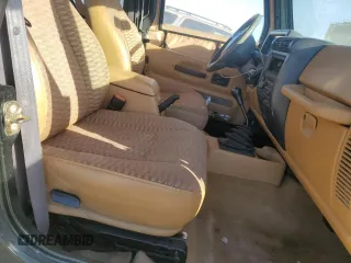 1998 Jeep Wrangler Sport with VIN 1J4FY19S0WP709843, listed as a Copart auction lot 74312254 with 147,010 mi miles and Salvage Title. Bid and sale history available at carsss.com. Image 7.