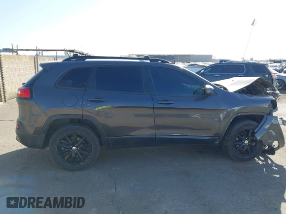 2014 Jeep Cherokee Latitude with VIN 1C4PJMCBXEW317384, listed as a IAAI auction lot 41621635 with 180,971 mi miles and . Bid and sale history available at DreamBid. Image 14.