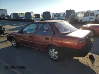 1989 Toyota Corolla with VIN JT2AE92E4K0112945, listed as a Copart auction lot 83382604 with 209,462 mi miles and Salvage title. Bid and sale history available at DreamBid. Image 2.