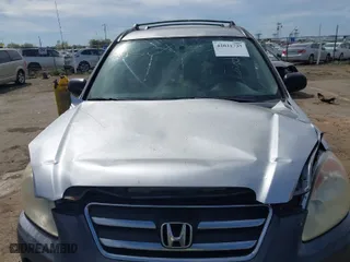 2005 Honda CR-V LX with VIN JHLRD68565C015724, listed as a IAAI auction lot 42021737 with 207,142 mi miles. Bid and sale history available at carsss.com. Image 6.