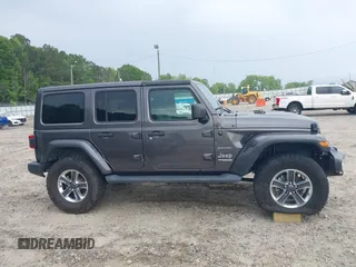 2018 Jeep Wrangler Unlimited Sahara with VIN 1C4HJXEN8JW303023, listed as a IAAI auction lot 42138631 with 72,463 mi miles and . Bid and sale history available at DreamBid. Image 13.