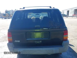 1996 Jeep Grand Cherokee Laredo with VIN 1J4GZ58S9TC268615, listed as a IAAI auction lot 41527984 with 248,443 mi miles. Bid and sale history available at carsss.com. Image 16.