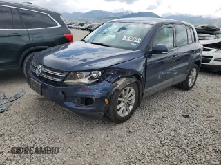 2014 Volkswagen Tiguan SEL with VIN WVGBV3AX1EW555823, listed as a Copart auction lot 56798025 with 114,194 mi miles and Salvage title. Bid and sale history available at DreamBid. Image 1.