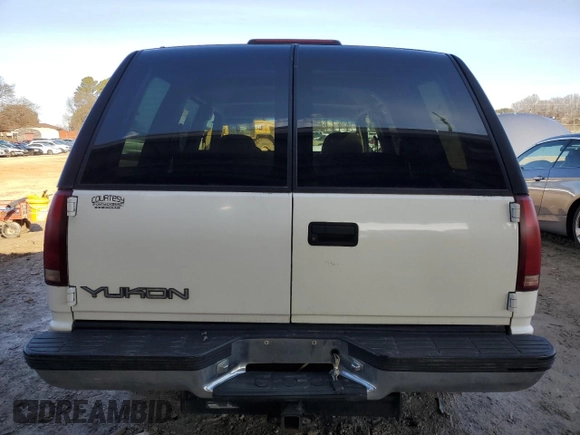 1999 GMC Yukon with VIN 1GKEC13R0XJ811710, listed as a Copart auction lot 43014995 with 311,948 mi miles and Salvage Title. Bid and sale history available at carsss.com. Image 6.