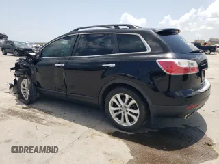 2012 Mazda CX-9 Grand Touring with VIN JM3TB2DA4C0361023, listed as a Copart auction lot 63839005 with 140,784 mi miles and Salvage title. Bid and sale history available at DreamBid. Image 2.