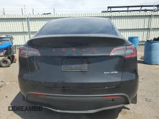 2023 Tesla Model Y Long Range z VIN 7SAYGDEE9PA115279, wystawiony jako Copart lot #55018275 z przebiegiem 43 026 mil mil oraz Szkoda całkowita • Salvage title. Historia ofert i sprzedaży dostępna na DreamBid. Obrazek 6.