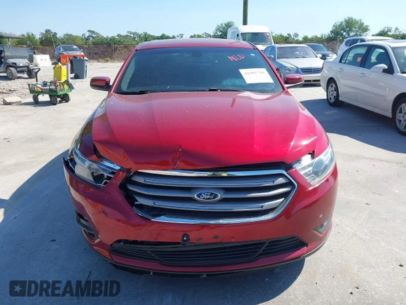 2014 Ford Taurus SEL with VIN 1FAHP2E86EG186642, listed as a IAAI auction lot 41901768 with 106,057 mi miles. Bid and sale history available at carsss.com. Image 12.