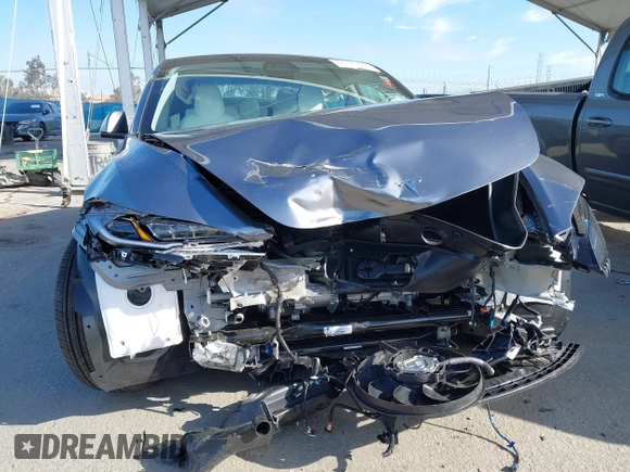 2025 Tesla Model 3 Long Range with VIN 5YJ3E1EA2SF885408, listed as a IAAI auction lot 41778498 with 1,566 mi miles and . Bid and sale history available at DreamBid. Image 6.