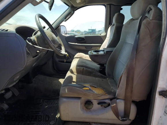 2003 Ford F-150 XL with VIN 2FTRX17213CA05950, listed as a Copart auction lot 54435115 with 310,503 mi miles and Salvage title. Bid and sale history available at DreamBid. Image 7.