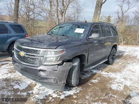 2015 Chevrolet Tahoe LT with VIN 1GNSCBKC0FR248246, listed as a IAAI auction lot 41002508 with 142,972 mi miles. Bid and sale history available at carsss.com. Image 2.