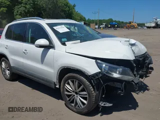2012 Volkswagen Tiguan SE with VIN WVGBV7AX0CW579809, listed as a IAAI auction lot 42533966 with 143,302 mi miles and . Bid and sale history available at DreamBid. Image 1.