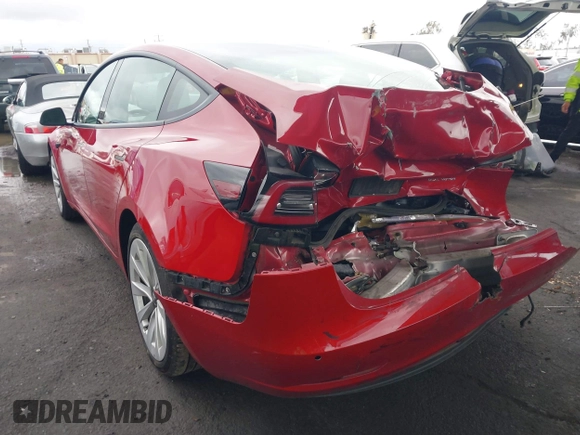 2021 Tesla Model 3 Long Range with VIN 5YJ3E1EB3MF862392, listed as a IAAI auction lot 41765987 with 51,915 mi miles and . Bid and sale history available at DreamBid. Image 3.