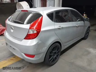 2013 Hyundai Accent GL with VIN KMHCT5AE3DU104651, listed as a IAAI auction lot 41522571 with 147,324 mi miles. Bid and sale history available at carsss.com. Image 4.