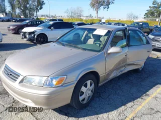 2001 Toyota Camry CE with VIN JT2BG22KX10559757, listed as a IAAI auction lot 41823719 with 72,775 mi miles. Bid and sale history available at carsss.com. Image 2.