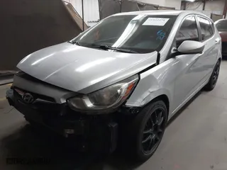 2013 Hyundai Accent GL with VIN KMHCT5AE3DU104651, listed as a IAAI auction lot 41522571 with 147,324 mi miles. Bid and sale history available at carsss.com. Image 2.