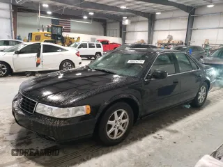 2002 Cadillac Seville Touring STS z VIN 1G6KY54962U158476, wystawiony jako Copart lot #86624774 z przebiegiem 77 818 mil mil oraz Szkody całkowita. Historia ofert i sprzedaży dostępna na DreamBid. Obrazek 1.