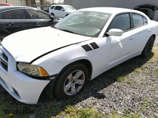 2011 Dodge Charger SE with VIN 2B3CL3CG5BH586886, listed as a IAAI auction lot 41910995 with 168,087 mi miles. Bid and sale history available at carsss.com. Image 2.