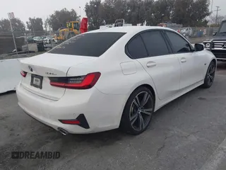 2022 BMW 3 Series 330e with VIN 3MW5P7J04N8C40865, listed as a IAAI auction lot 41635704 with 44,929 mi miles. Bid and sale history available at carsss.com. Image 4.