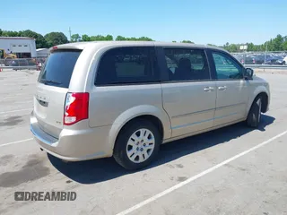 2015 Dodge Grand Caravan American Value with VIN 2C4RDGBG3FR647957, listed as a IAAI auction lot 42147813 with 129,859 mi miles and . Bid and sale history available at DreamBid. Image 4.