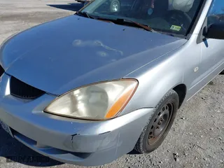 2004 Mitsubishi Lancer ES with VIN JA3AJ26E64U035168, listed as a IAAI auction lot 41625806 with 176,232 mi miles. Bid and sale history available at carsss.com. Image 16.