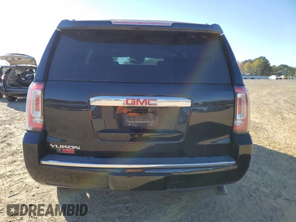2018 GMC Yukon Denali with VIN 1GKS2CKJ3JR404177, listed as a Copart auction lot 82577354 with 129,744 mi miles and Salvage Title. Bid and sale history available at carsss.com. Image 6.