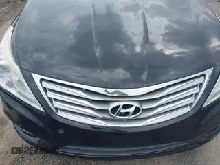 2014 Hyundai Azera Limited z VIN KMHFH4JG5EA353031, wystawiony jako IAAI lot #42481763 z przebiegiem 90 244 mil mil oraz . Historia ofert i sprzedaży dostępna na DreamBid. Obrazek 6.