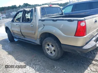 2003 Ford Explorer Sport Trac XLS z VIN 1FMZU77E23UC35868, wystawiony jako IAAI lot #42530211 z przebiegiem 223 483 mil mil oraz . Historia ofert i sprzedaży dostępna na DreamBid. Obrazek 3.
