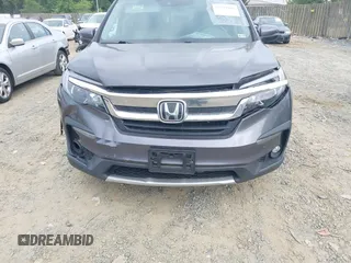 2019 Honda Pilot EX-L with VIN 5FNYF5H45KB018293, listed as a IAAI auction lot 42318481 with 76,617 mi miles and . Bid and sale history available at DreamBid. Image 6.