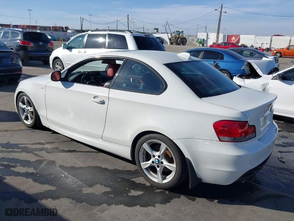 2011 BMW 1 Series 128i with VIN WBAUP9C53BVL89535, listed as a IAAI auction lot 41619966 with 184,610 mi miles. Bid and sale history available at carsss.com. Image 3.