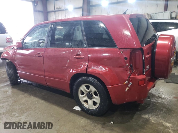 2011 Suzuki Grand Vitara Premium with VIN JS3TD0D25B4102081, listed as a Copart auction lot 43978955 with 310,535 mi miles and Salvage title. Bid and sale history available at DreamBid. Image 2.