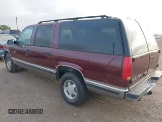 1999 GMC Suburban with VIN 1GKEC16R3XJ707787, listed as a IAAI auction lot 41826640 with 175,437 mi miles. Bid and sale history available at carsss.com. Image 3.