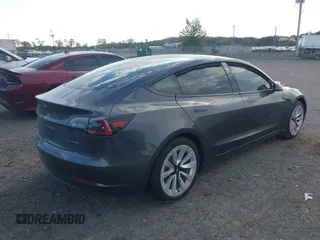 2021 Tesla Model 3 Long Range with VIN 5YJ3E1EB6MF975916, listed as a IAAI auction lot 40713749 with 29,593 mi miles and . Bid and sale history available at DreamBid. Image 4.
