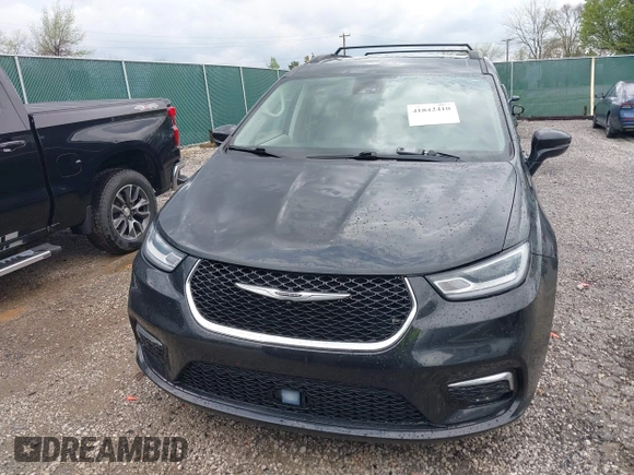 2022 Chrysler Pacifica Touring L with VIN 2C4RC1BG9NR194782, listed as a IAAI auction lot 41842410 with 76,231 mi miles and . Bid and sale history available at DreamBid. Image 12.