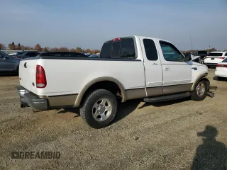 1999 Ford F-150 XL with VIN 1FTRX17L2XKC10123, listed as a Copart auction lot 83158894 with 57,446 mi miles and Salvage Title. Bid and sale history available at carsss.com. Image 3.