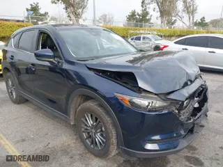 2019 Mazda CX-5 Touring with VIN JM3KFACM5K0697137, listed as a IAAI auction lot 41720253 with 50,416 mi miles. Bid and sale history available at carsss.com. Image 1.