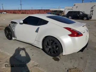 2014 Nissan 370Z Nismo with VIN JN1AZ4EH0EM635111, listed as a Copart auction lot 87292134 with 185,356 mi miles and Salvage Title. Bid and sale history available at DreamBid. Image 2.