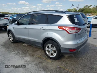 2013 Ford Escape SE with VIN 1FMCU9GX0DUC37218, listed as a Copart auction lot 53992485 with 188,571 mi miles and Salvage Title. Bid and sale history available at DreamBid. Image 2.