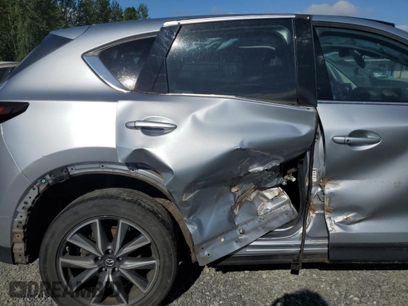 2018 Mazda CX-5 Grand Touring с VIN JM3KFBDM5J0323923, выставлен на аукционе Copart как лот 58162435 с пробегом 144 792 миль миль и Списание • Salvage title. История ставок и продаж доступна на DreamBid. Изображение 11.