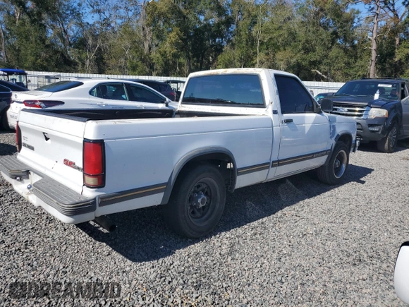 1993 GMC Sonoma with VIN 1GTCS14R2P8516409, listed as a Copart auction lot 42676805 with 225,122 mi miles and Salvage Title. Bid and sale history available at DreamBid. Image 3.