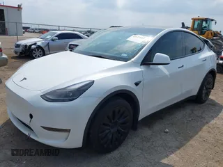 2023 Tesla Model Y Long Range with VIN 7SAYGAEEXPF776370, listed as a IAAI auction lot 42127512 with 27,120 mi miles and . Bid and sale history available at DreamBid. Image 2.