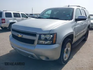 2011 Chevrolet Tahoe LS with VIN 1GNSCAE0XBR111949, listed as a IAAI auction lot 42630787 with 220,857 mi miles and . Bid and sale history available at DreamBid. Image 2.