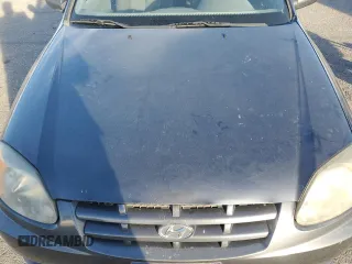 2005 Hyundai Accent GLS with VIN KMHCG35C65U359247, listed as a Copart auction lot 79305324 with 120,985 mi miles and Salvage Title. Bid and sale history available at carsss.com. Image 13.