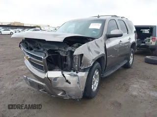 2013 Chevrolet Tahoe LS with VIN 1GNSCAE06DR105066, listed as a IAAI auction lot 41586288 with 161,639 mi miles and . Bid and sale history available at DreamBid. Image 2.