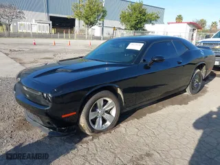 2021 Dodge Challenger SXT with VIN 2C3CDZAG9MH630736, listed as a IAAI auction lot 41633520 with 62,895 mi miles. Bid and sale history available at carsss.com. Image 2.